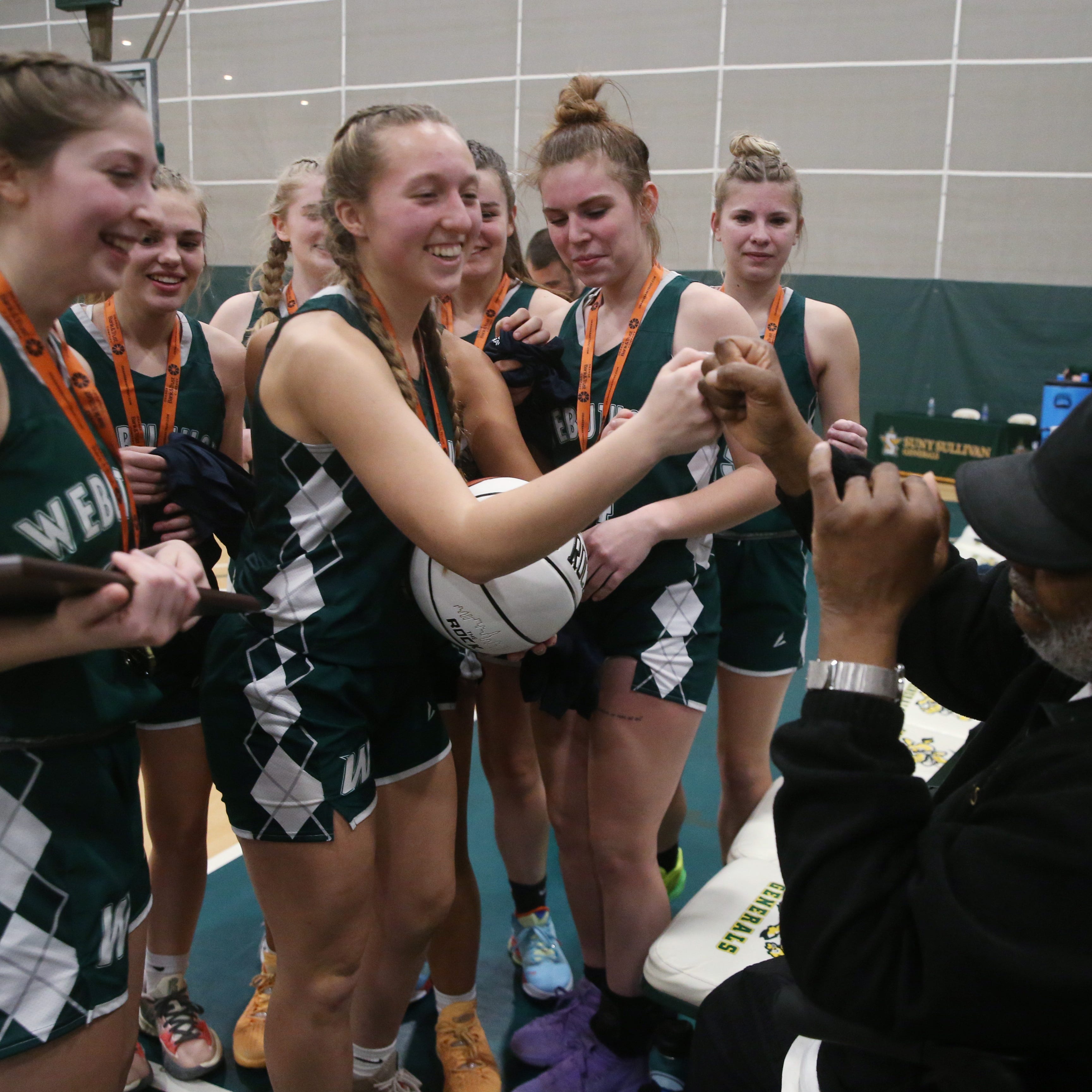 Webutuck's, Morgan Sprague gives head coach Ken Dawson a fist bump after winning the Section 9 Class D girls basketball final versus Livingston Manor at SUNY Sullivan on March 1, 2023. 