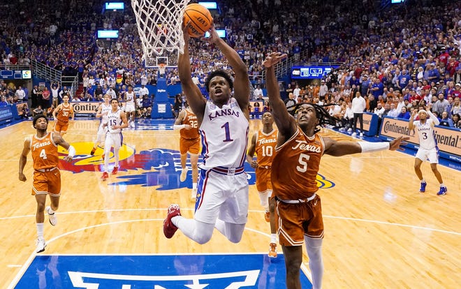 Kansas guard Joseph Yesufu goes up for a dunk against Texas guard Marcus Carr during the second half at Allen Fieldhouse.