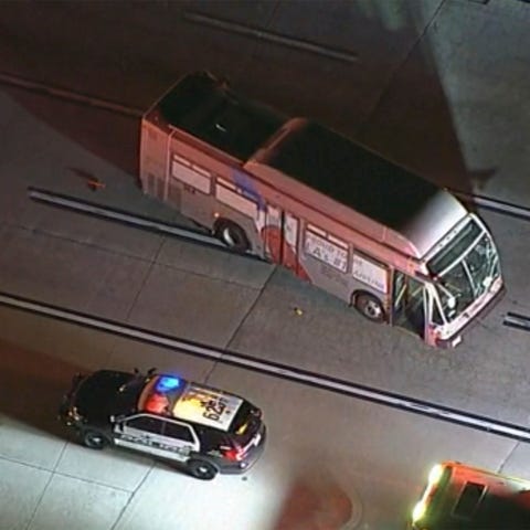 An American Airlines bus on an airport taxiway bef