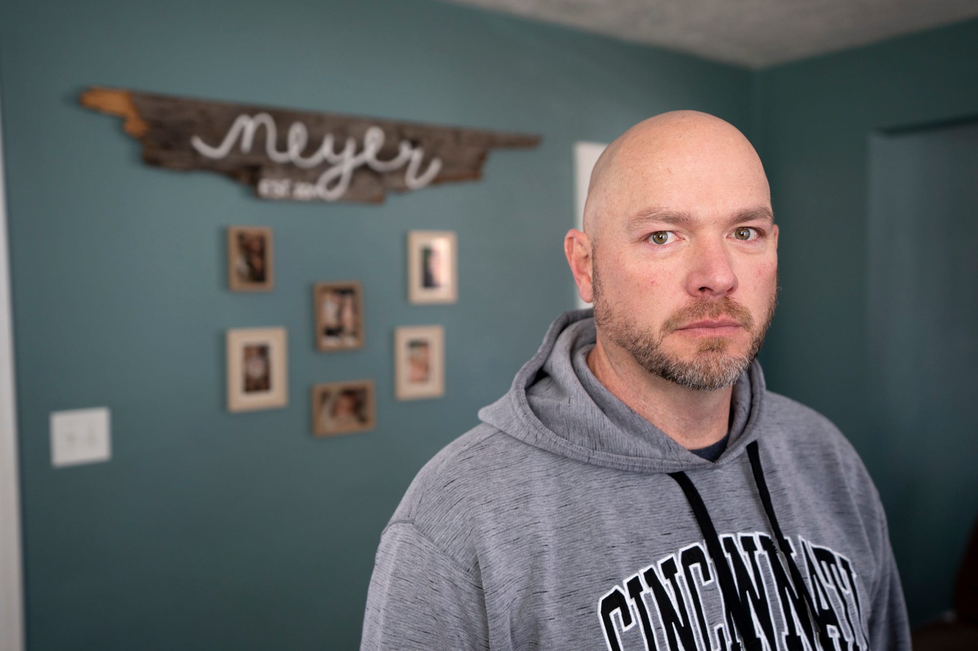 Paul Neyer stands inside his home on Sunday, Feb. 12, 2023. Paul Neyer decided to come forward with abuse allegations against Father Geoff Drew almost 30 years after he was abused. 