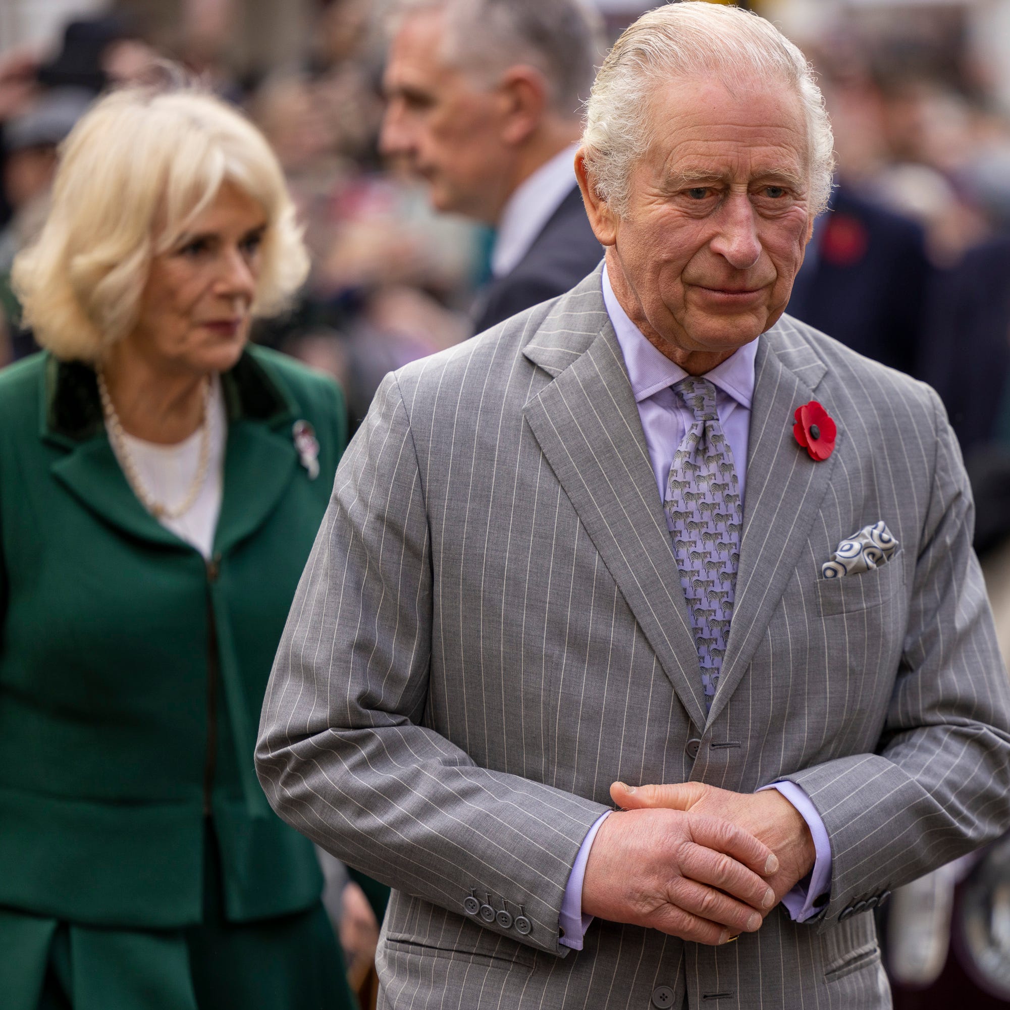 FILE - Britain's King Charles III and Camilla, Queen Consort, walkabout to meet members of the public following a ceremony at Micklegate Bar, in York, England, Wednesday Nov. 9, 2022.  King Charles III will travel to France and Germany for his first state visits since becoming monarch, underscoring Britain's efforts to build bridges with its European neighbors. Buckingham Palace announced Friday, March 3, 2023 that Charles and Camilla, the queen consort, will visit the European Union's two biggest countries March   26-31, hosted by Presidents Emanuel Macron of France and Frank-Walter Steinmeier of Germany. (James Glossop/Pool Photo via AP, File) ORG XMIT: AMB107
