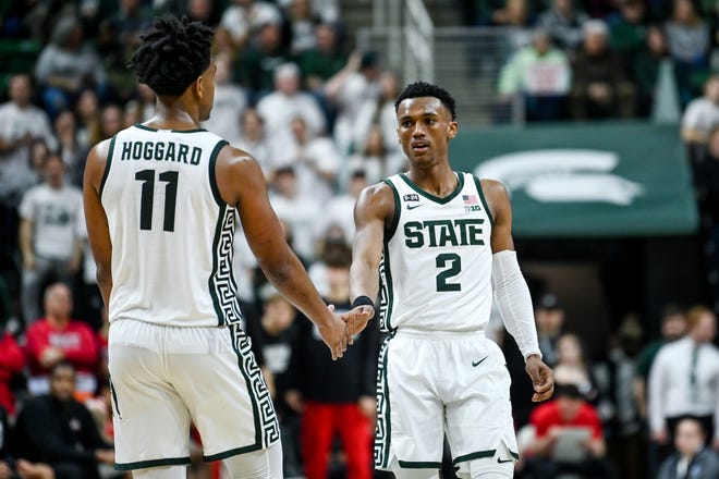 Michigan State's Tyson Walker, right, slaps hands with A.J. Hoggard during the second half in the game against Ohio State on Saturday, March 4, 2023, at the Breslin Center in East Lansing.