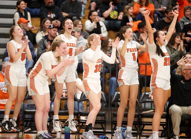 Silverton bench reacts to a three-point basket against Canby during the second half at Silverton High School, Friday, March 3, 2023, in Silverton, Ore. 