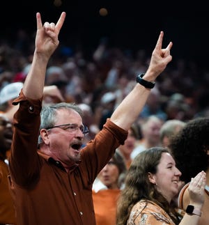 Texas fans celebrate during the first half of Saturday's 75-59 win over Kansas. The Horns went 17-1 in their first season in the new facility while the women went 14-2.