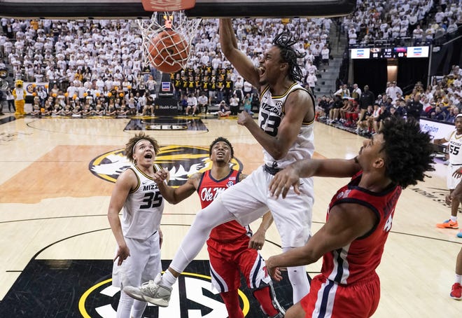 Mar 4, 2023; Columbia, Missouri, USA; Missouri Tigers forward Aidan Shaw (23) dunks the ball as Mississippi Rebels forward Jaemyn Brakefield (4) defends during the second half at Mizzou Arena. Mandatory Credit: Denny Medley-USA TODAY Sports