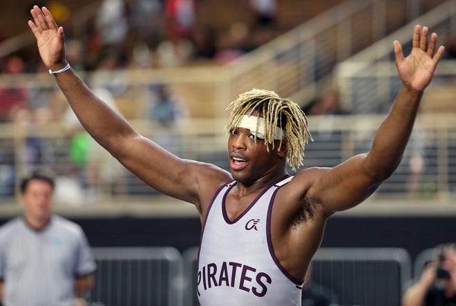 Jessey Colas of Braden River High celebrates after defeating Michael McCarthy of Satellite for the Class 2A 182-pound title at the FHSAA State Wrestling Championships Saturday at Silver Spurs Arena in Kissimmee.
