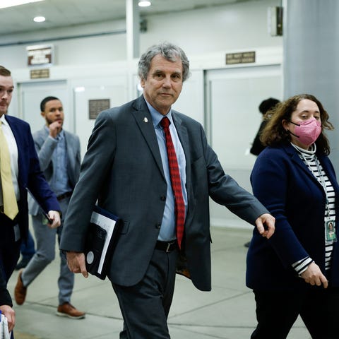 Sen. Sherrod Brown, D-Ohio walks to a closed-door,