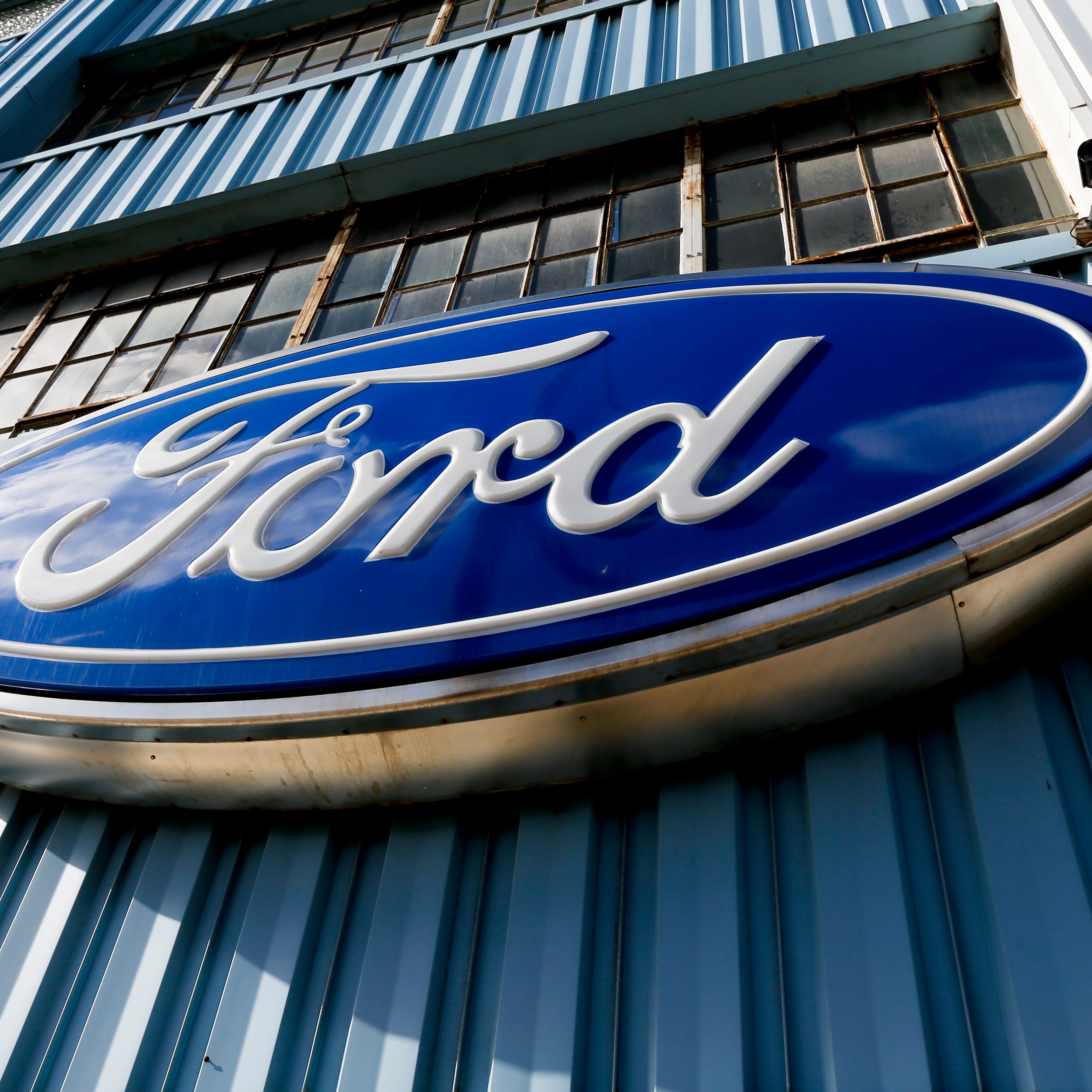 This Thursday, Nov. 19, 2015, photo, shows a blue oval Ford sign above the entrance to Butler County Ford in Butler, Pa. Ford announced Tuesday, Jan. 26, 2016, that the company is recalling nearly 391,000 Ranger pickups because the driver's air bag inflators can explode with too much force and cause injuries. The recall covers trucks from 2004 through 2006 in the U.S. and Canada. (AP Photo/Keith Srakocic) ORG XMIT: NYBZ214