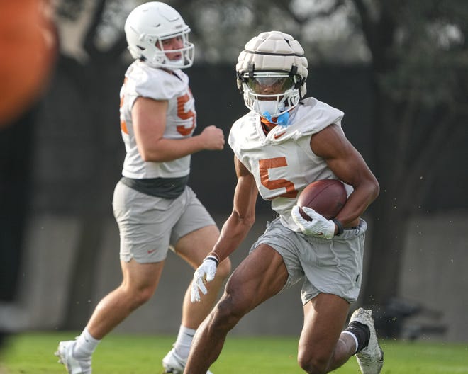 New Texas wide receiver Adonai Mitchell works on kick returns Monday morning during the team's first spring football practice at Frank Denius Fields. Mitchell, a transfer from Georgia, could make an immediate impact in the passing game.