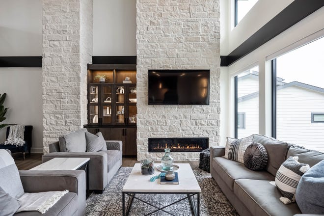 This $1.5 million modern home in Ankeny features a heated pool, 6 bedrooms and killer views through two-story windows.