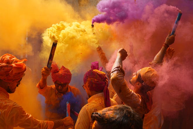 People sing, dance and throw colors at each other to celebrate Holi festival in Hyderabad, India on March 6, 2023. The festival will be observed on March 8, but the festivities start almost a week in advance. It is celebrated across India to welcome good harvests, warm weather, and the defeat of evil.