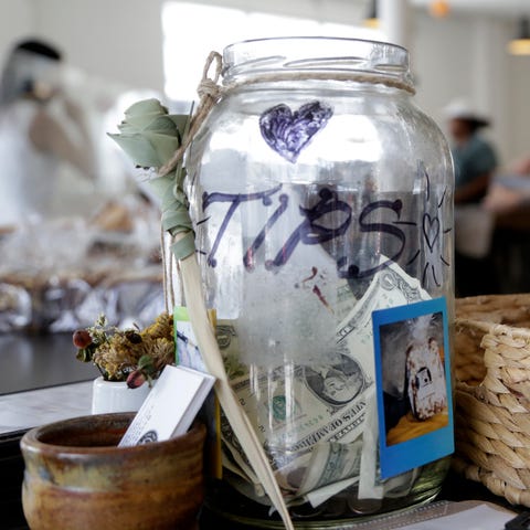 A tip jar sits on a counter at Zak the Baker in Mi