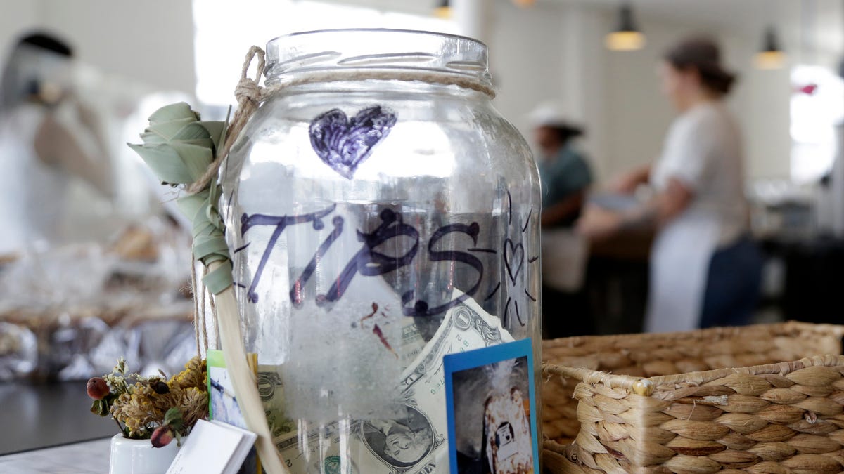 A tip jar sits on a counter at Zak the Baker in Miami on June 20, 2018.