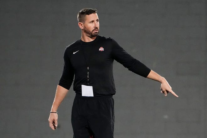 Mar 7, 2023; Columbus, Ohio, USA;  Ohio State Buckeyes offensive coordinator Brian Hartline motions during spring football drills at the Woody Hayes Athletic Center. Mandatory Credit: Adam Cairns-The Columbus Dispatch