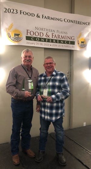 NDSU Carrington Research Extension Center’s Karl Hoppe and Steve Zwinger (retired) receive awards at the Northern Plains Food and Farming Conference.