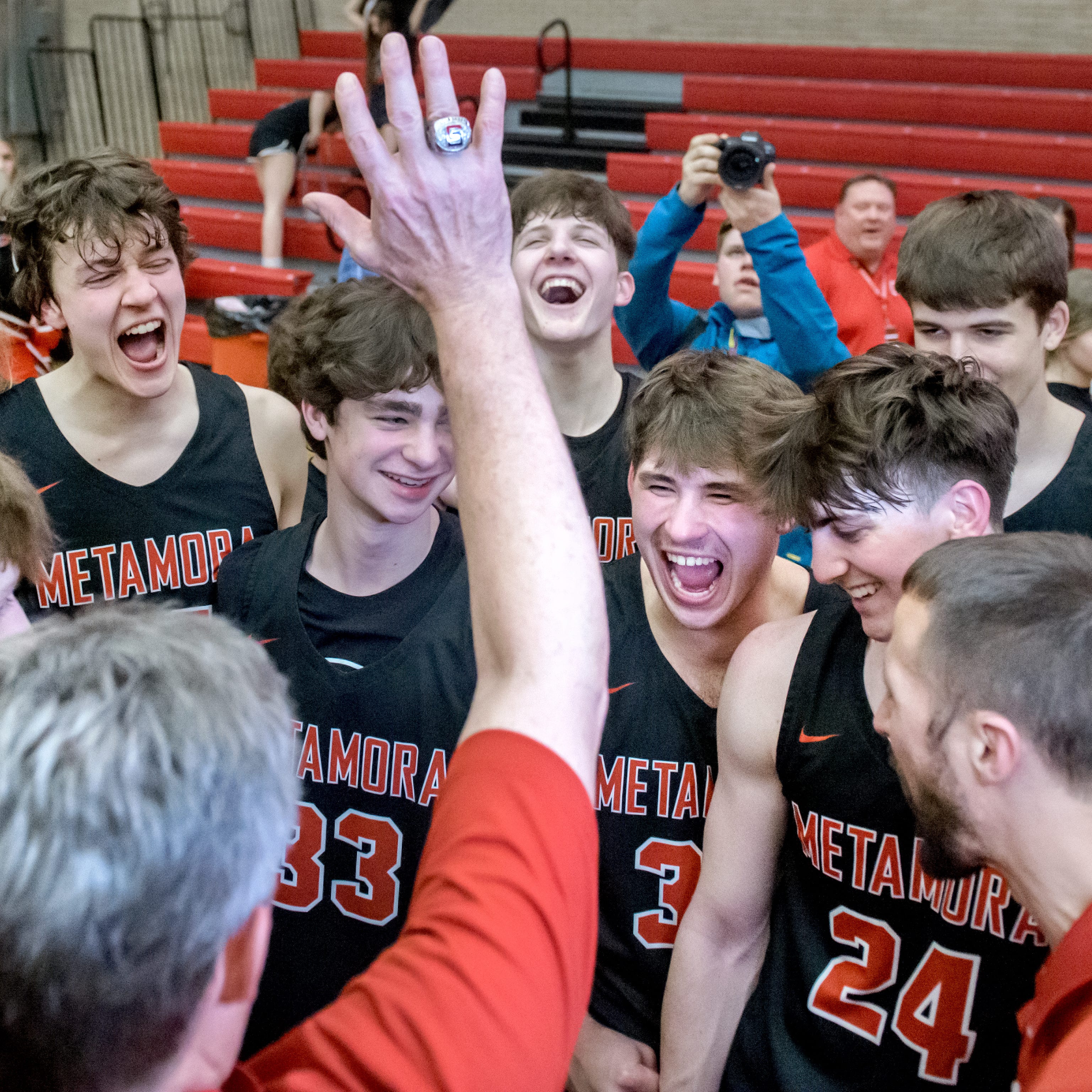 Metamora head coach Danny Grieves pumps up his players after the Redbirds 60-48 victory over Marmion Academy in the Class 3A supersectional Monday, March 6, 2023 at Ottawa High School.