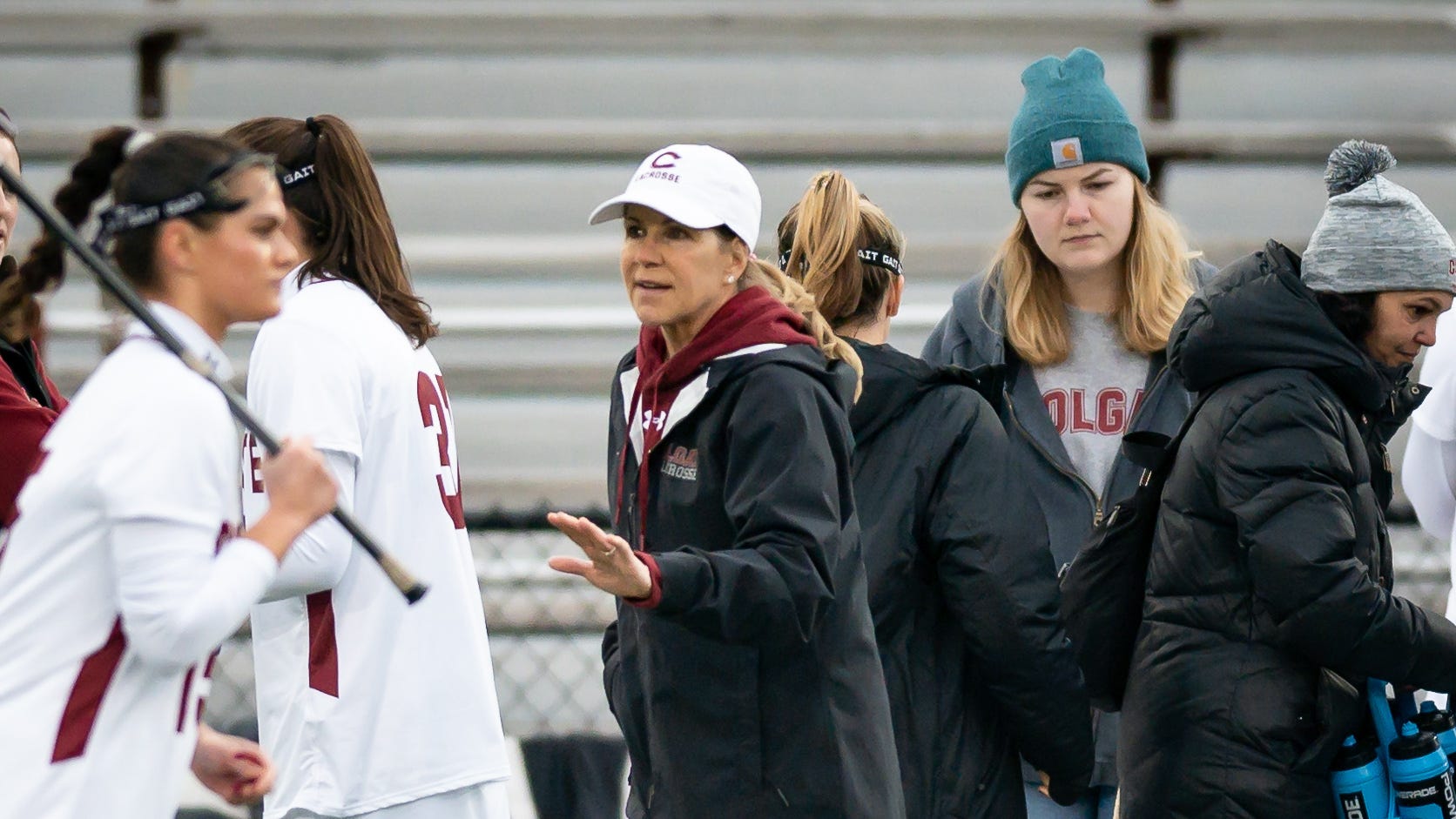 Colgate Women's Lacrosse Head Coach Kathy Taylor gives instructions to her players on the sideline during a home game at Colgate University. 
