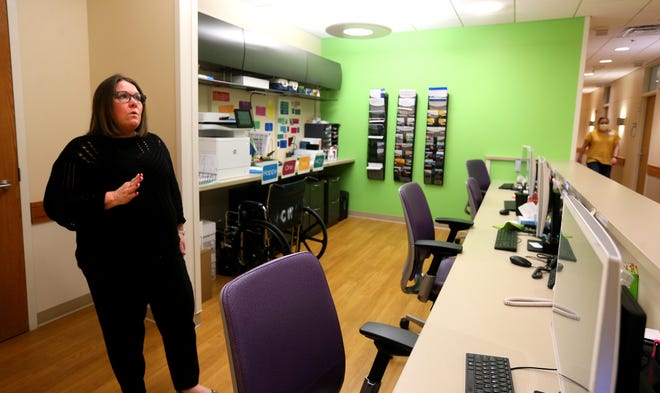 Tammy Makhlouf walks through Human Resources at the Craig Yabuki Mental Health Walk-In Clinic in Children's Wisconsin in early March.  Children who previously had pressing mental health issues would have been referred to an emergency room.  Now the children are being taken to the clinic