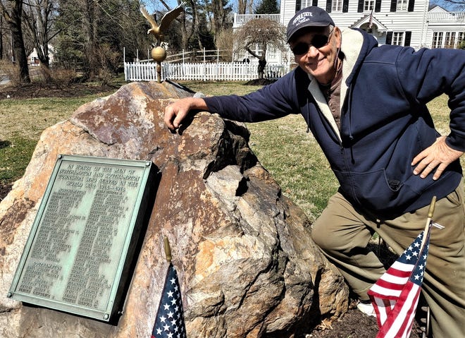Historian Richard Noe beside the original World War I memorial at the busy and dangerous intersection of Bristol Road and Bustleton Pike in Churchville.
