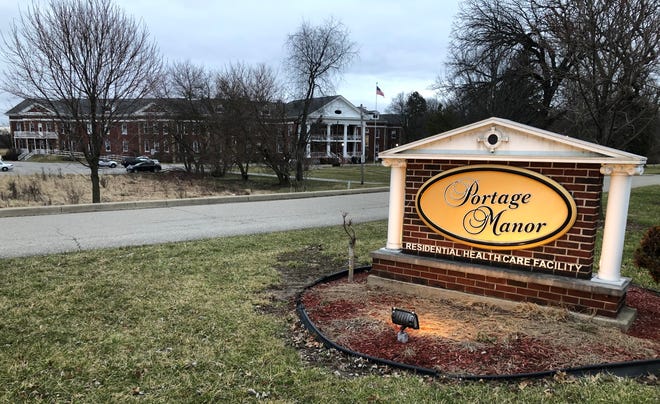 A sign greets the public at the entrance drive to Portage Manor in South Bend on March 2, 2023.