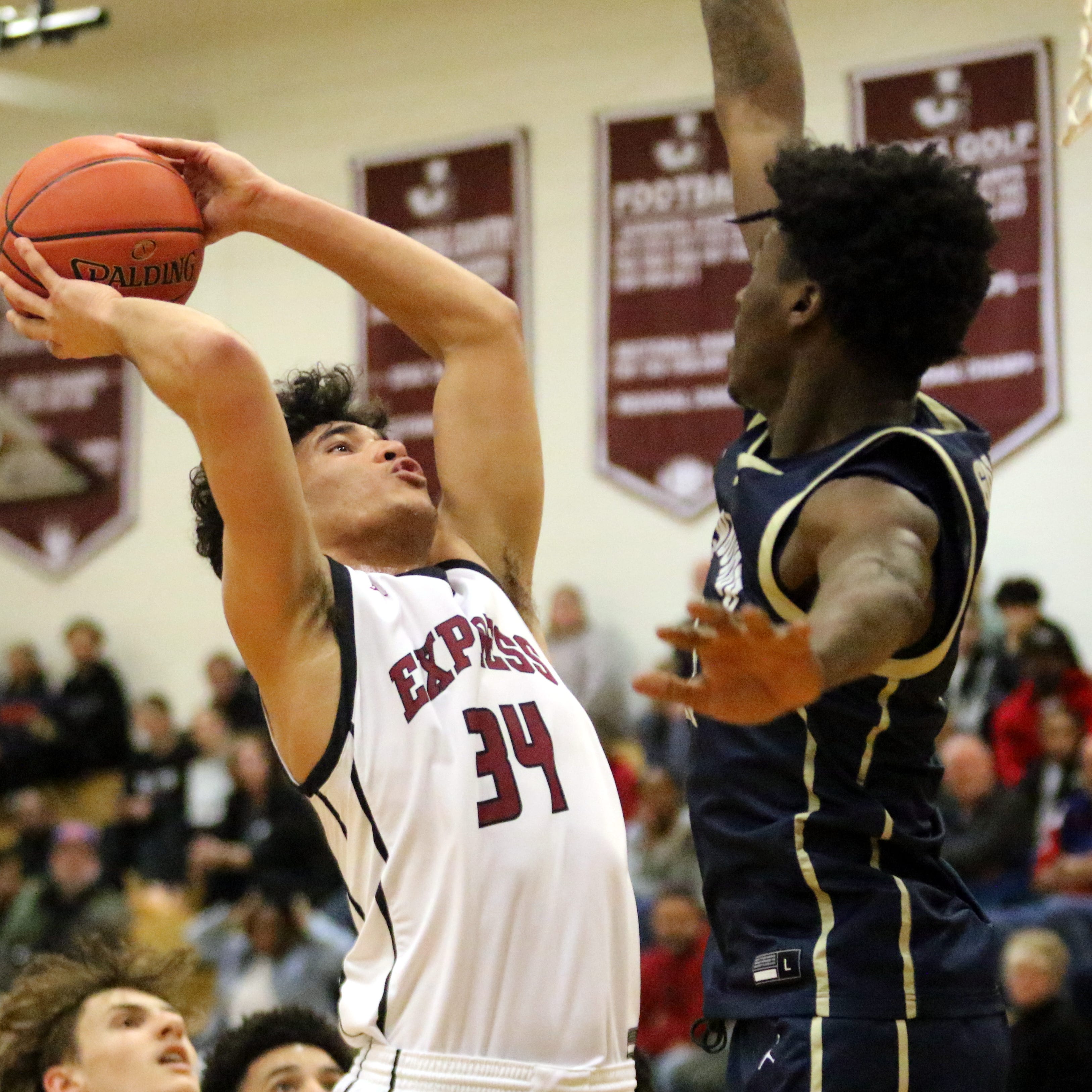 Elmira's Anthony Kitching goes up for a shot as Newburgh Free Academy's Deondre Johnson defends during the Goldbacks' 50-49 win in a NYSPHSAA Class AA boys basketball regional semifinal March 7, 2023 at Johnson City High School.