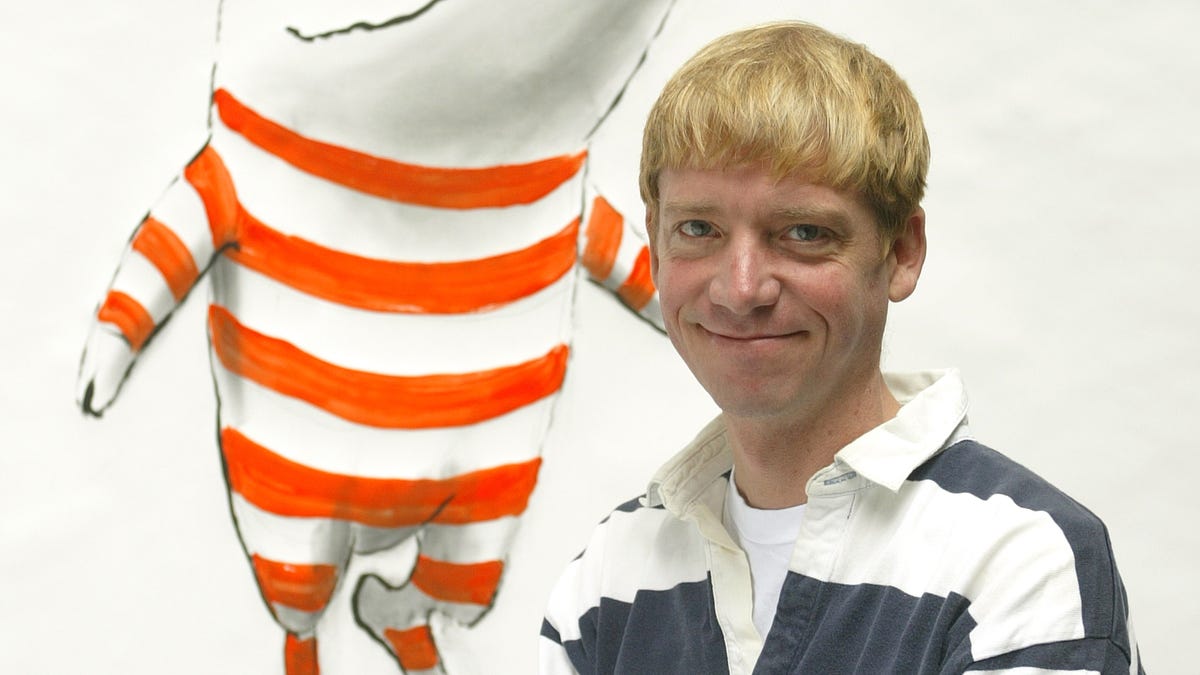 Artist Ian Falconer, the creator of Olivia the Pig, paints the character in his Manhattan backyard.