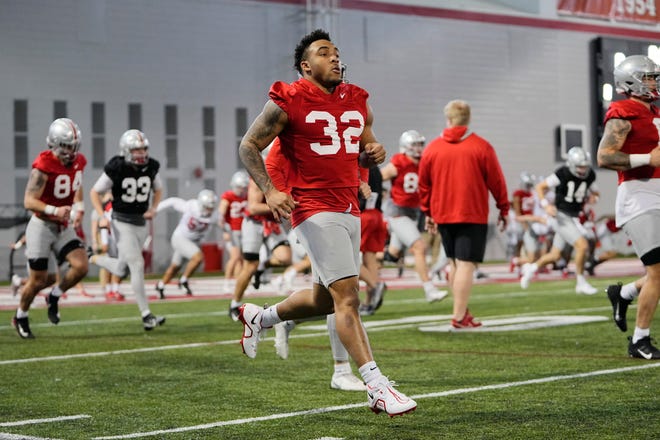 Mar 9, 2023; Columbus, Ohio, USA;  Ohio State Buckeyes running back TreVeyon Henderson (32) runs during spring football practice at the Woody Hayes Athletic Center. Mandatory Credit: Adam Cairns-The Columbus Dispatch
