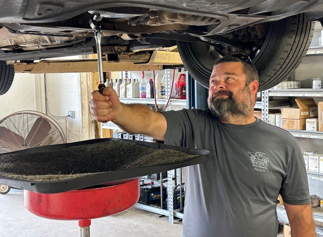 Ben Causton, owner of Rhodes Auto Repairs, says he would much rather be working on vehicles, than doing office work.