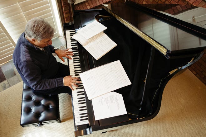 Dan Yessian, Milford resident, plays music on his piano formerly owned by his hero, Burt Bacharach. Yessian is the composer of 'An Armenian Trilogy,' and will be featured in a new PBS documentary premiering March 12, 2023.