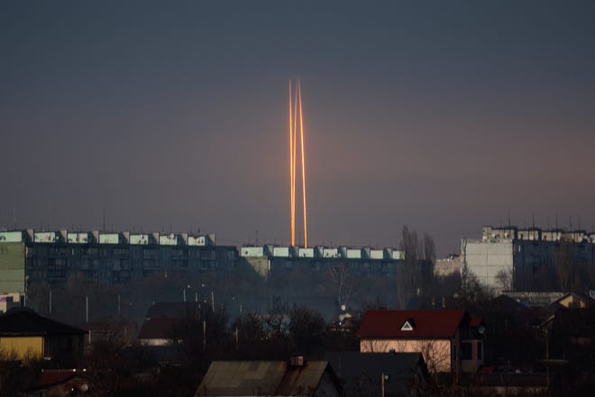 Three rockets launched against Ukraine from Russia's Belgorod region are seen at dawn in Kharkiv, Ukraine, Thursday, March 9, 2023.