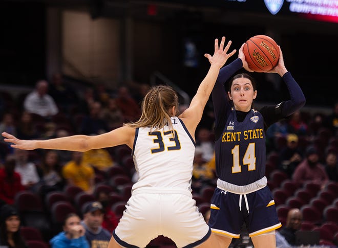 Kent State's Katie Shumate looks to make a play as Toledo's Sammi Mikonowicz defends during the MAC Tournament semifinals, Friday, March 10, 2023, in Cleveland.