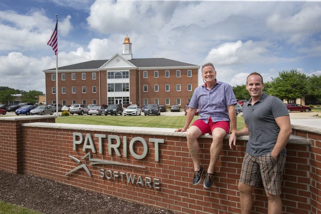 Patriot Software is among the businesses impacted by the swift collapse of Silicon Valley Bank. In this 2018 file photo, Patriot Software CEO Michael J. Kappel, left, and Chief Legal Officer Michael A. Wheller sit outside their building at 4883 Dressler Rd. NW in Jackson Township.