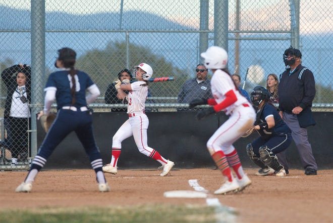 Oak Hills’ Holly Medina connects on a pitch for a double against Silverado during the sixth inning on Thursday, March 9, 2023.