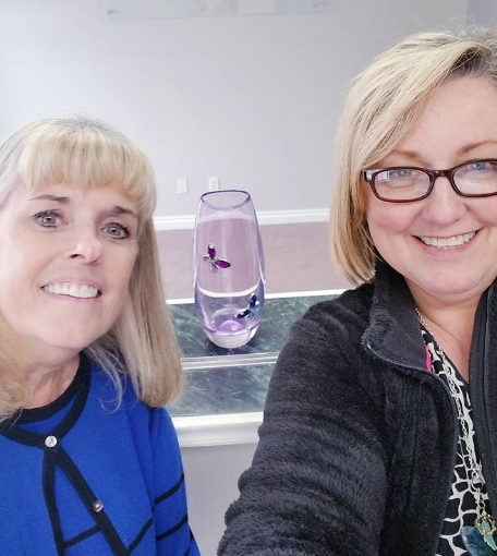 Suzie Abbott and Debbie Heisler take a selfie on the day they first got the keys to the Blue Butterfly House, a nonprofit they started to help families maintain their relationships in a safe, happy space while also working out legal issues.