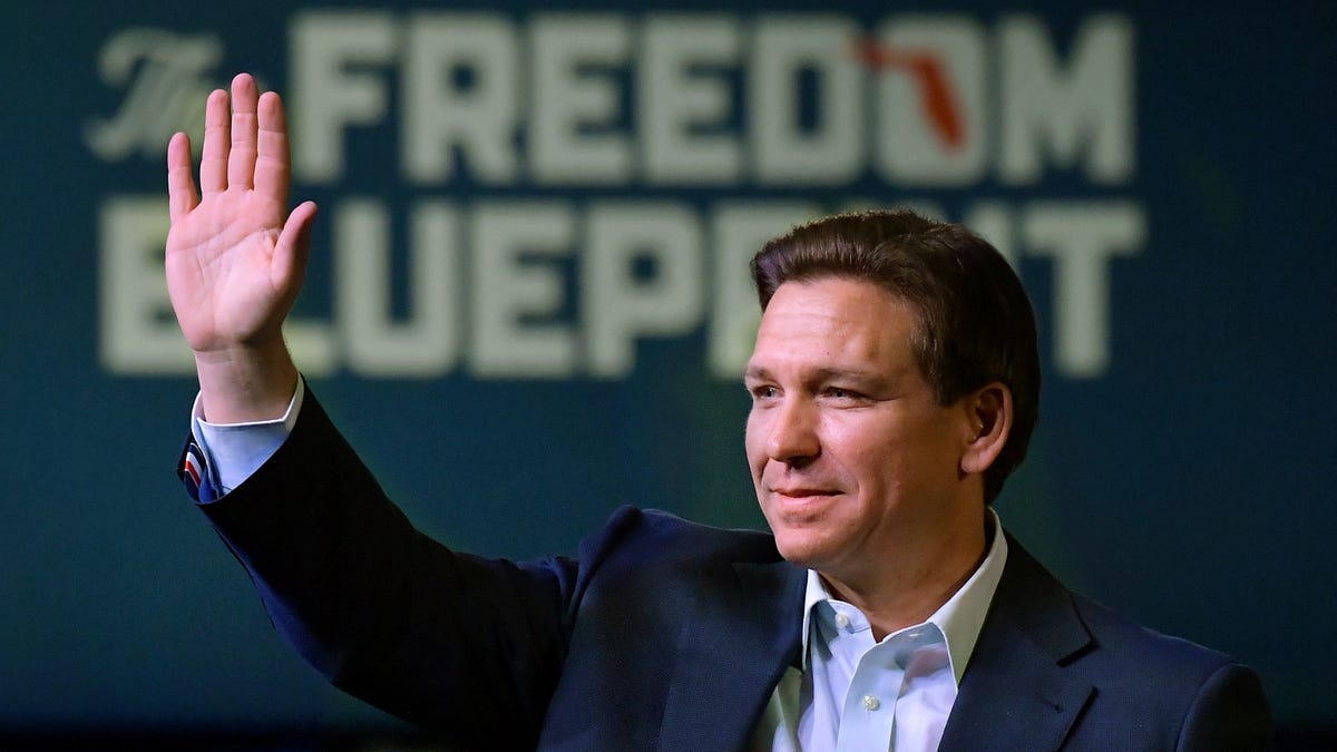 Florida Gov. Ron DeSantis waves to the crowd as he attends an event Friday, March 10, 2023, in Davenport, Iowa.