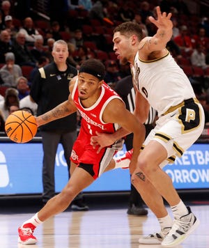 Ohio State Buckeyes guard Roddy Gayle Jr. (1) drives past Purdue Boilermakers forward Mason Gillis (0) in the Big Ten Men's Basketball Tournament semifinals, Saturday, March 11, 2023 , at the United Center in Chicago. 