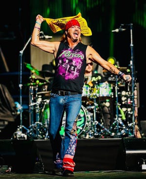 Bret Michaels, a Pennsylvania native, waves the Pittsburgh Steelers' "Terrible Towel" during a stop on The Stadium Tour in 2022.