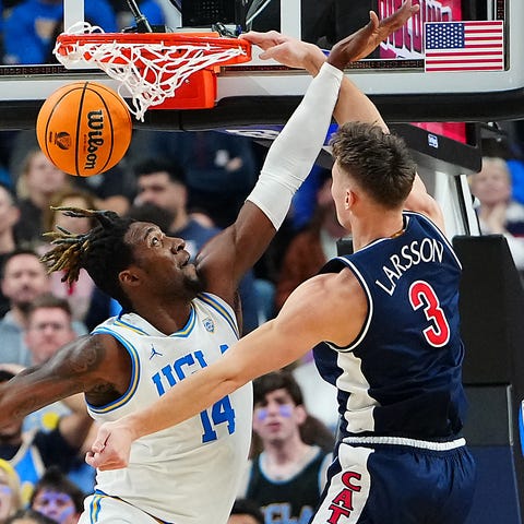 Arizona's Pelle Larsson dunks against UCLA.