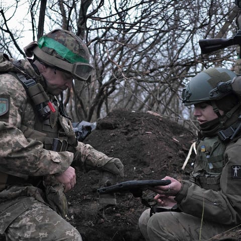 Soldiers of the Ukrainian Volunteer Army hold thei