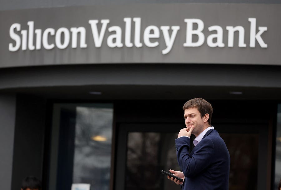 A customer stands outside of a shuttered Silicon Valley Bank (SVB) headquarters on March 10, 2023 in Santa Clara, California. Silicon Valley Bank was shut down on Friday morning by California regulators and was put in control of the U.S. Federal Deposit Insurance Corporation.