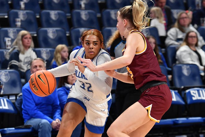 St. Louis University junior forward Peyton Kennedy drives to the basket against Loyola of Chicago. Kennedy is a former all-stater from Boylan who helped the Billikens reach the NCAA tourney for the first time this season.