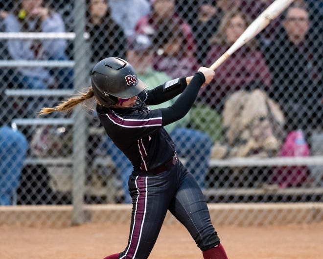 Round Rock's Cat Hobdy connects for a single during the Dragons' 1-0 win over Cedar Ridge on Tuesday night, a key win for the District 25-6A race. The Dragons and Raiders now are co-leaders in the district.