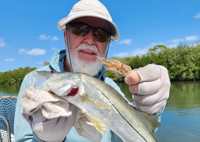 Geno Giza's hand-tied fly ruffled his hair with this snook, which was caught, and released into the Indian River.