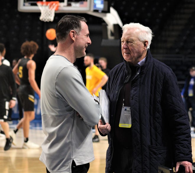 NKU head coach Darrin Horn chats with CBS broadcaster Bill Raftery as Northern Kentucky University's men's basketball team practiced at Legacy Arena in Birmingham, Ala., where the Norse will play Houston Thursday night in the first round of the NCAA Tournament.