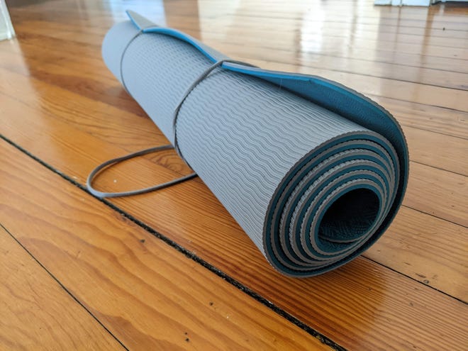 A yoga mat is the latest accessory in Abbey's fitness quest.