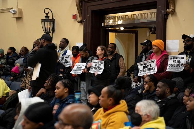 People calling for justice for Najee Seabrooks look on during a Paterson City Council meeting on Tuesday, March 14, 2023. Seabrooks, a member of the violence intervention group the Paterson Healing Collective, was fatally shot by Paterson police after a standoff while he was barricaded inside an apartment.