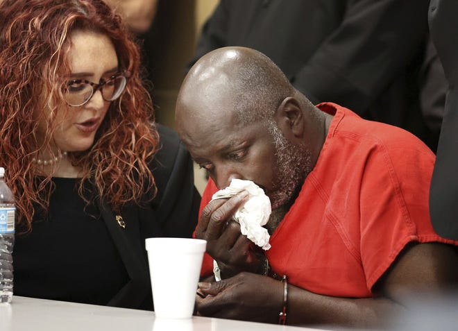 Sidney Holmes, 57, cries after he was exonerated in a Broward County courtroom on March 13. Holmes served more than 34 years of a 400-year sentence for a 1988 armed robbery.