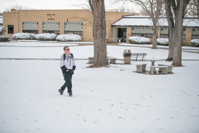 Abigail Roberts walks throught the snow-covered campus of Pueblo Community College on Thursday, March 16, 2023.