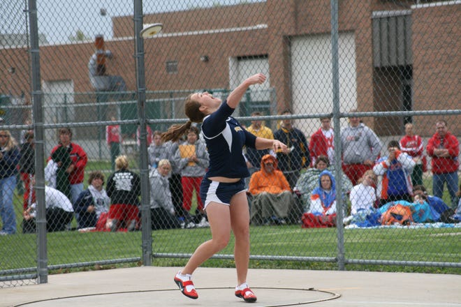 Woodmore's Emily Pendleton breaks a state record with her discus throw of 183 feet, 3 inches at the Oak Harbor Invitational.