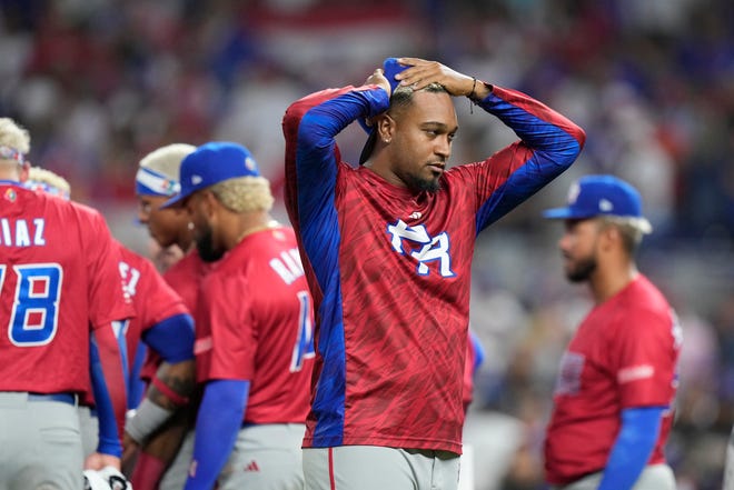 Puerto Rico players react after pitcher Edwin Diaz appeared to be injured during postgame celebration after Puerto Rico beat the Dominican Republic 5-2 during a World Baseball Classic game. Diaz was indeed injured and is expected to miss the 2023 season.